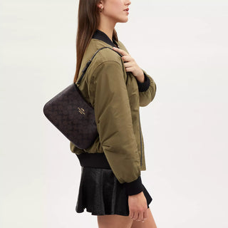 Cartera Coach Penelope in signature canvas